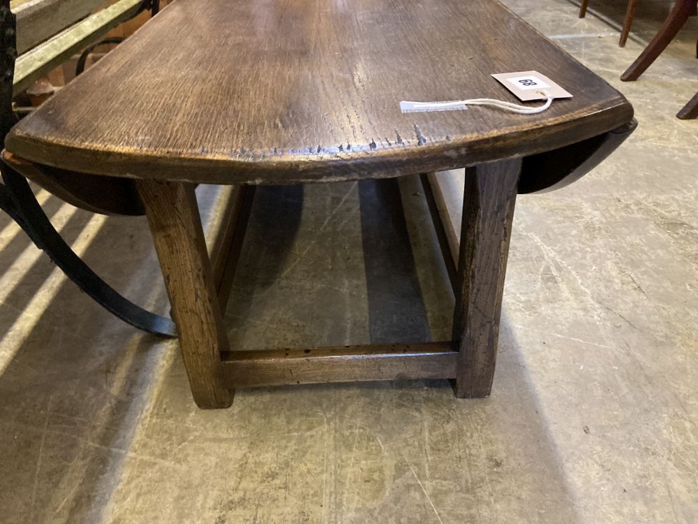 A reproduction oak drop flap coffee table, width 150cm, depth 45cm, height 43cm